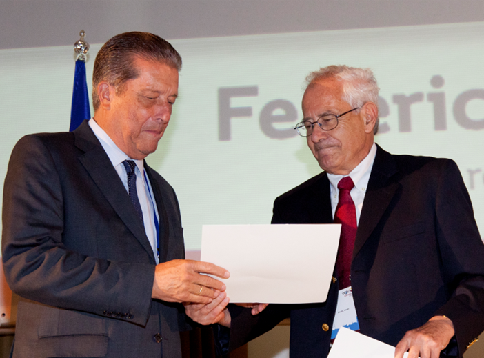 Prof. Federico Mayor-Zaragoza (left) receiving the FEBS Diplôme d’Honneur from Prof. Israel Pecht, FEBS Secretary General